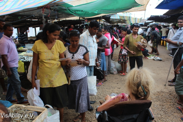 2015-07-05 VisAbility - Distribution of flyers - Market in Anuradhapura